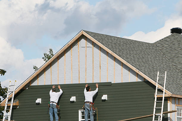 Professional Siding Installation technician working in Commack, NY